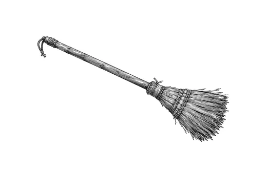 A handmade straw broom with a worn wooden handle.
